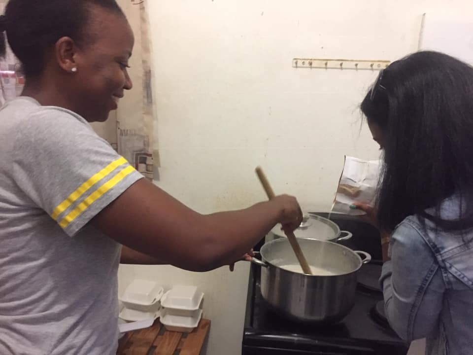 Ladies stirring pot for adopt a block